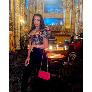 Beautiful black Houseofcb top. Will look like you’re wearing a piece of art.